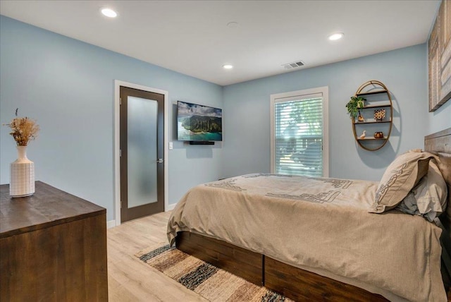 bedroom featuring light hardwood / wood-style flooring