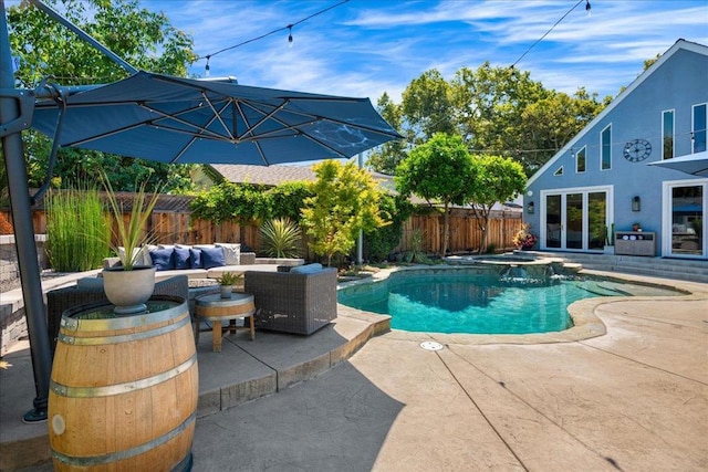 view of swimming pool with a patio, outdoor lounge area, and an in ground hot tub