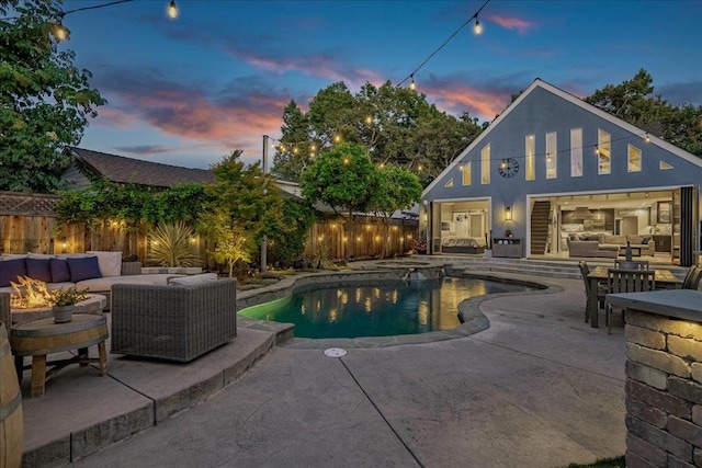 pool at dusk with an outdoor living space and a patio