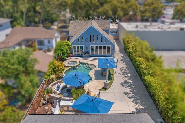 view of swimming pool featuring an in ground hot tub and a patio area