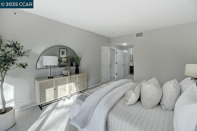 bedroom featuring light colored carpet