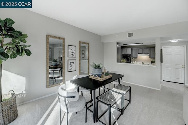 view of carpeted dining area