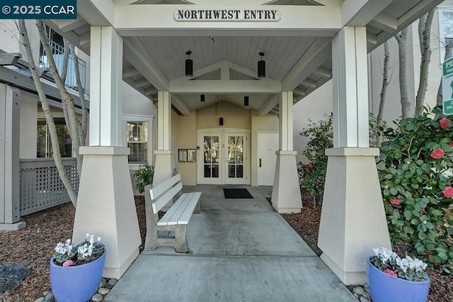 view of exterior entry featuring french doors