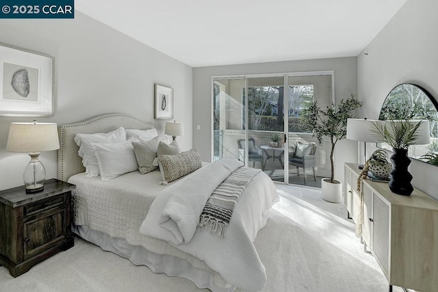 bedroom featuring access to exterior and light colored carpet