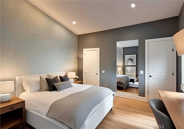 562 24th Pl, Hermosa Beach, CA 90254 - bedroom with an accent wall, light wood-style floors, recessed lighting, and wallpapered walls