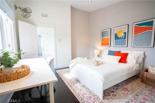 bedroom with wood-type flooring