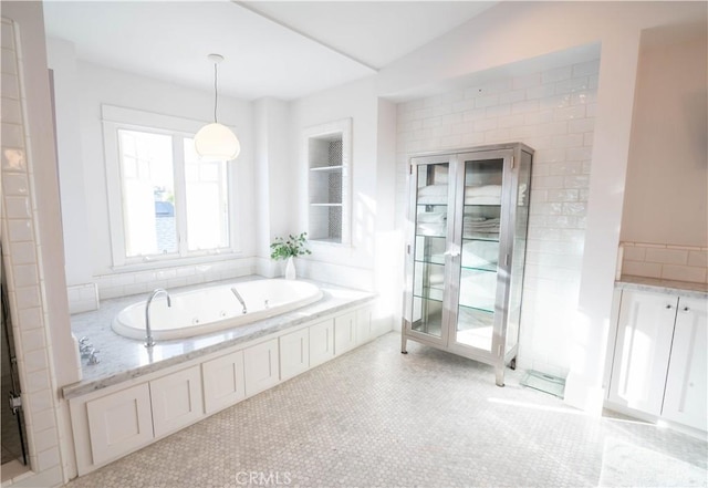 bathroom featuring a washtub