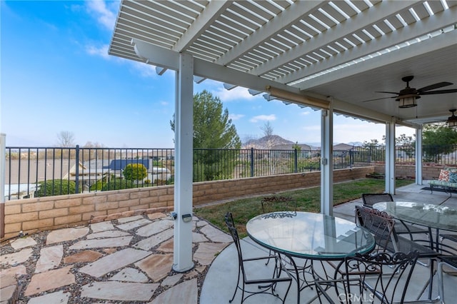 view of patio / terrace featuring ceiling fan and a pergola