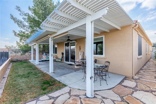 view of patio / terrace featuring ceiling fan and a pergola