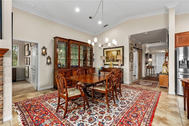 dining area featuring high vaulted ceiling, ornamental molding, light tile patterned floors, a barn door, and an inviting chandelier