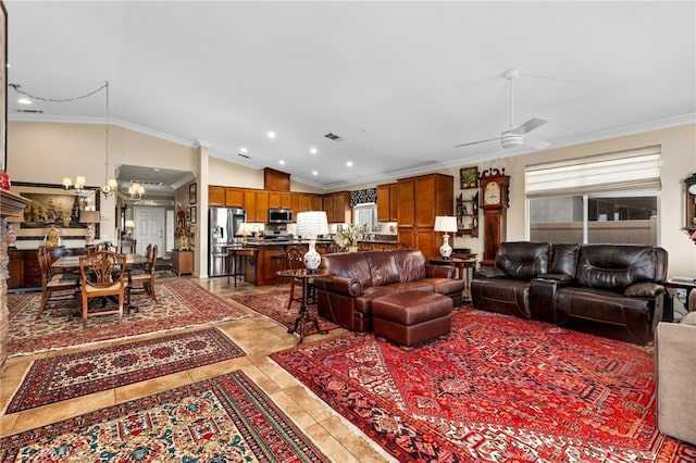 living room with ornamental molding, lofted ceiling, plenty of natural light, and light tile patterned flooring