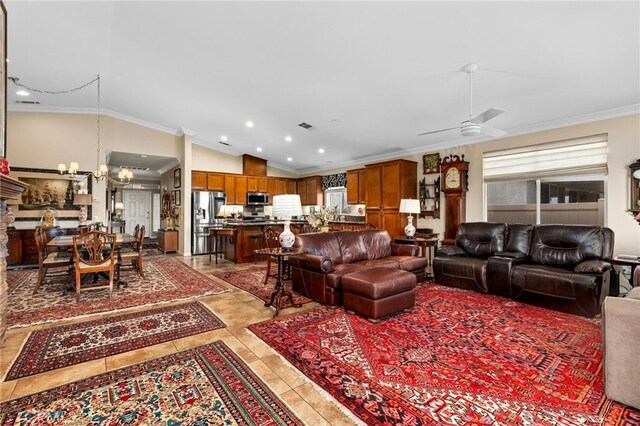 tiled living room featuring crown molding, lofted ceiling, plenty of natural light, and ceiling fan with notable chandelier