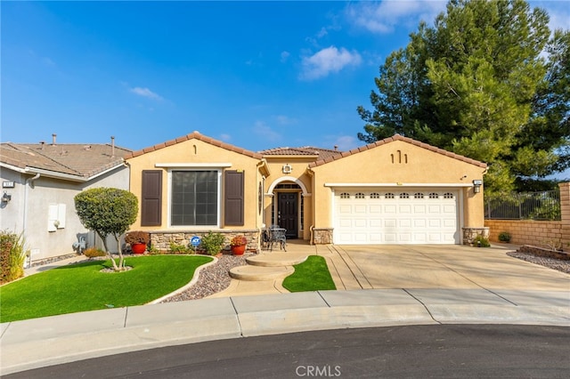 view of front of home featuring a garage and a front yard