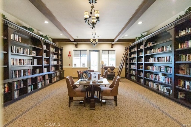 living area with an inviting chandelier and beam ceiling