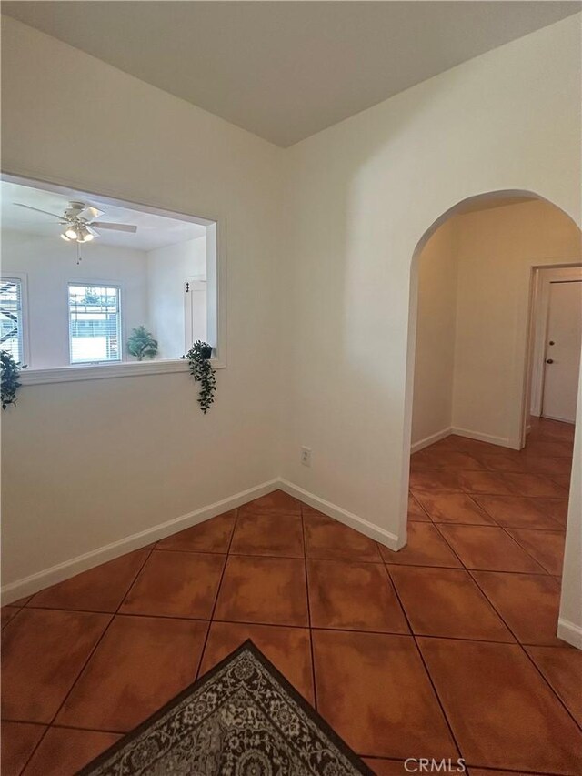 2121 James M Wood Blvd Unit 224, Los Angeles, CA 90006 - spare room featuring arched walkways, tile patterned flooring, and ceiling fan