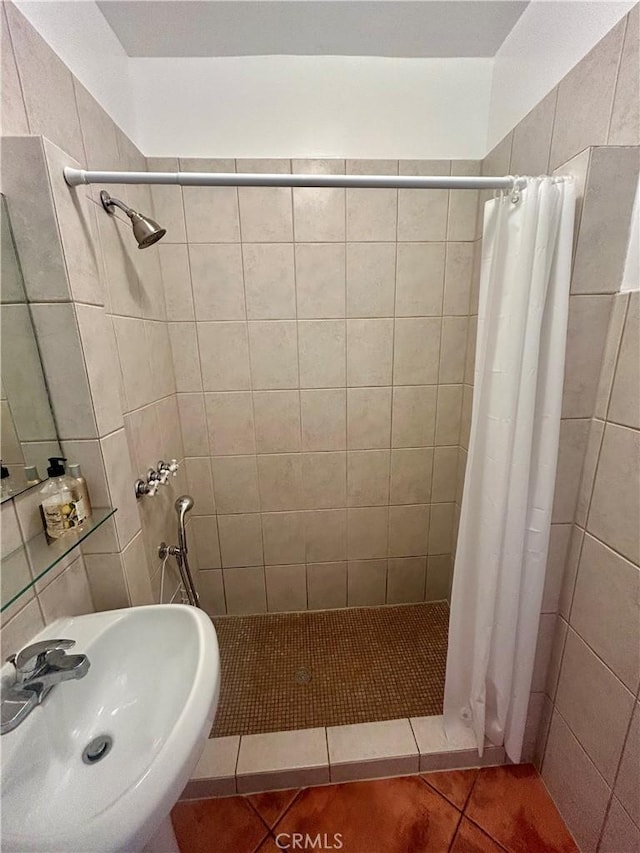 2121 James M Wood Blvd Unit 224, Los Angeles, CA 90006 - full bath with tile patterned flooring, a shower stall, and tile walls