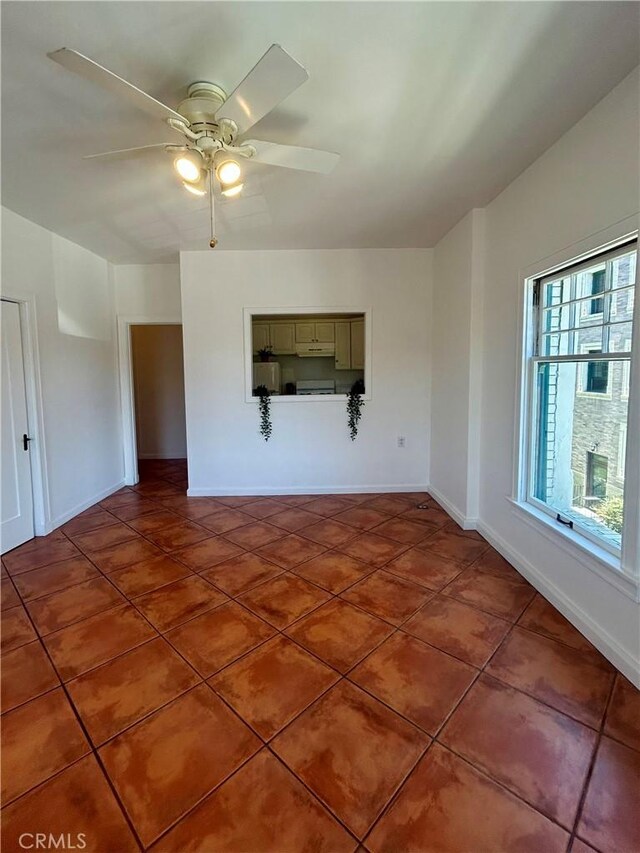2121 James M Wood Blvd Unit 224, Los Angeles, CA 90006 - unfurnished room featuring a ceiling fan and tile patterned flooring