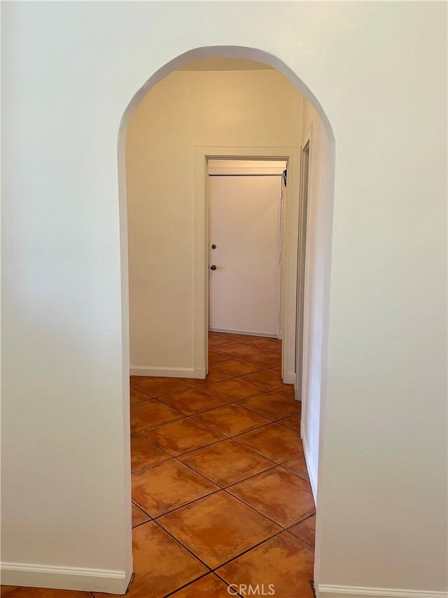 2121 James M Wood Blvd Unit 224, Los Angeles, CA 90006 - corridor with light tile patterned floors and arched walkways