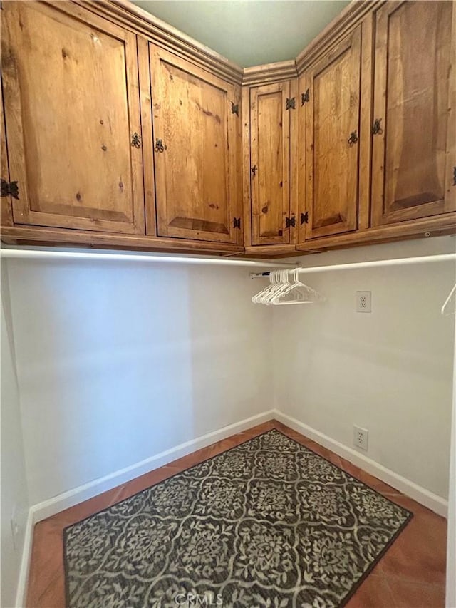2121 James M Wood Blvd Unit 224, Los Angeles, CA 90006 - laundry room featuring baseboards