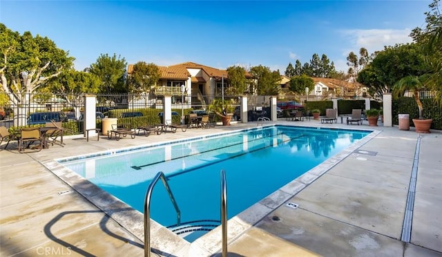 view of swimming pool with a patio area