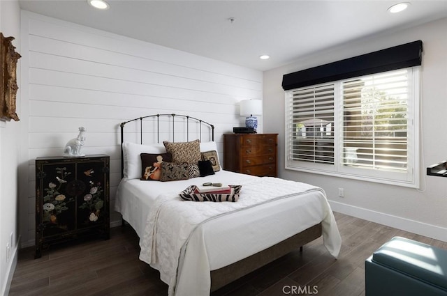 bedroom with dark wood-type flooring