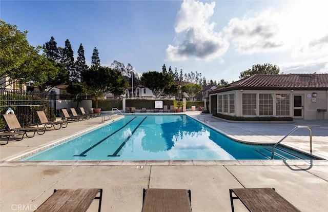 view of swimming pool featuring a patio