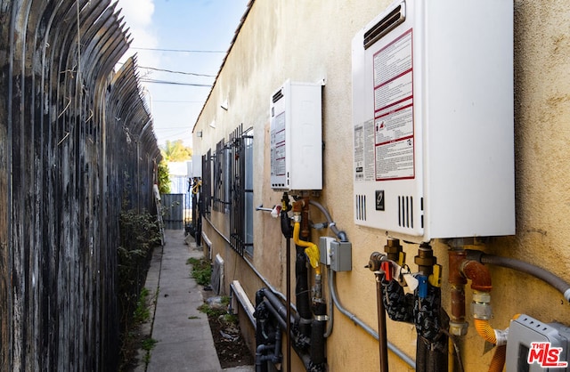 view of property exterior featuring tankless water heater