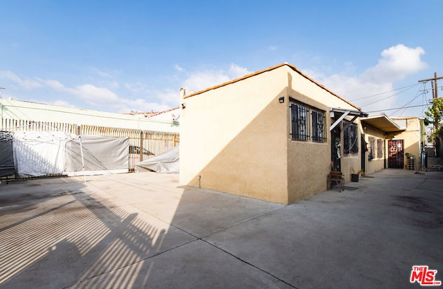 view of home's exterior featuring a patio