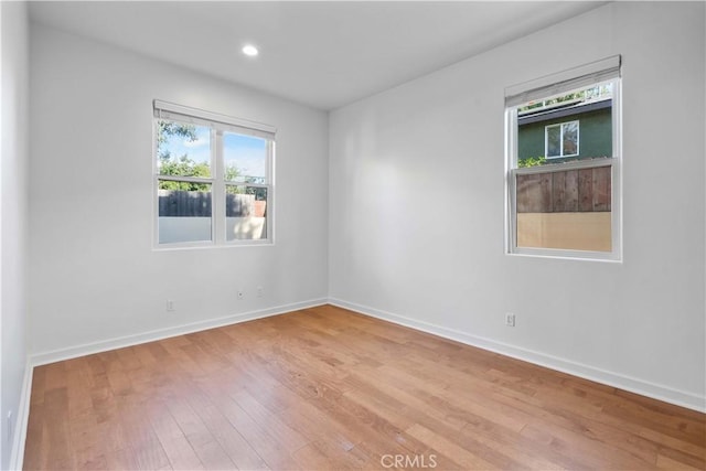 unfurnished room featuring light wood-type flooring