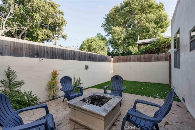 view of patio / terrace featuring a fire pit