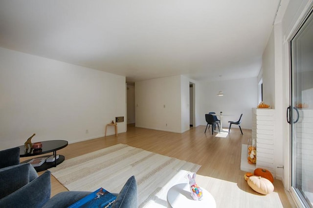 living room with light hardwood / wood-style flooring