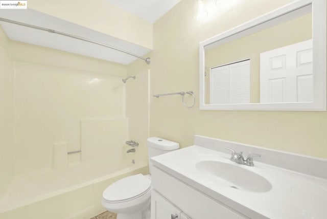 full bathroom featuring toilet, vanity, and bathtub / shower combination