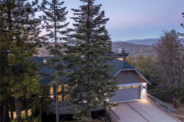 view of front of home featuring a mountain view