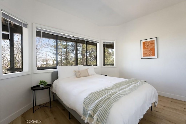 bedroom with wood-type flooring