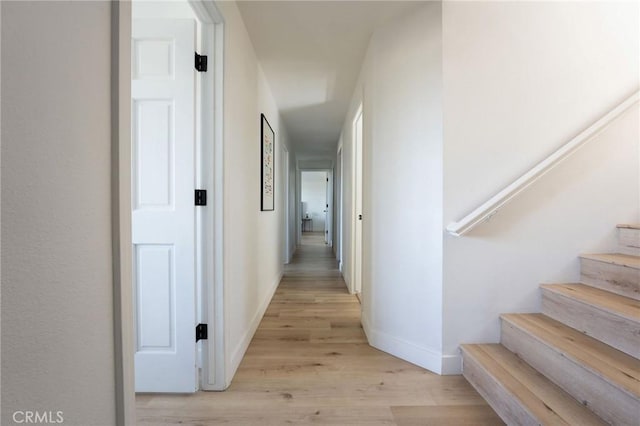 corridor featuring light hardwood / wood-style floors