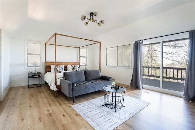 bedroom featuring access to outside and light hardwood / wood-style floors