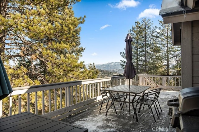 deck featuring a mountain view and grilling area