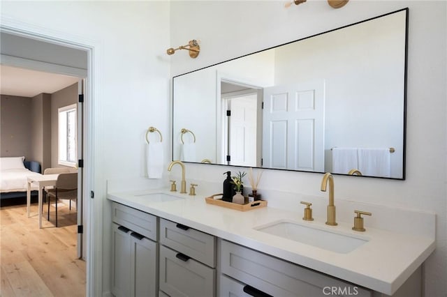 bathroom with vanity and wood-type flooring