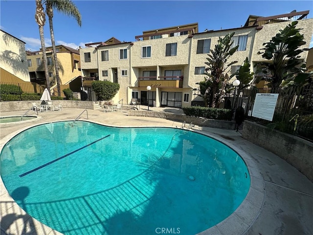 view of swimming pool featuring a patio