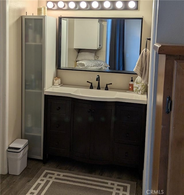 bathroom featuring wood-type flooring and vanity