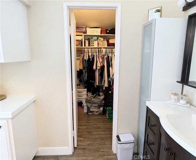 bathroom with vanity and hardwood / wood-style floors