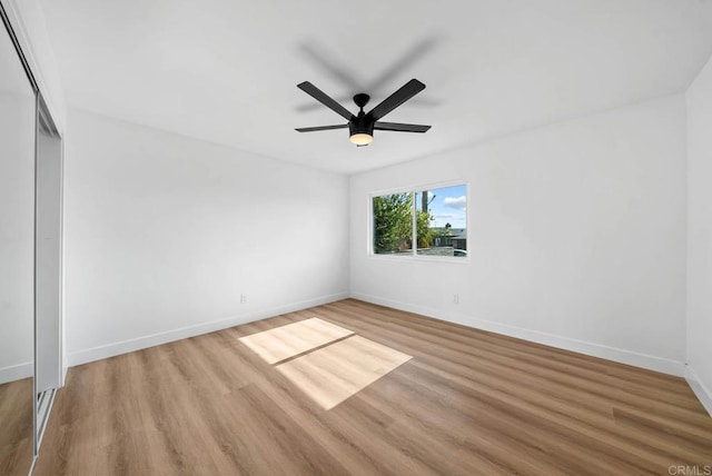 interior space with ceiling fan, a closet, and light wood-type flooring