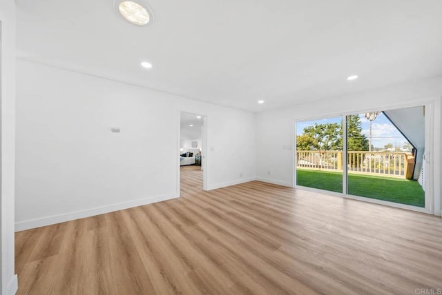 unfurnished living room with light wood-type flooring