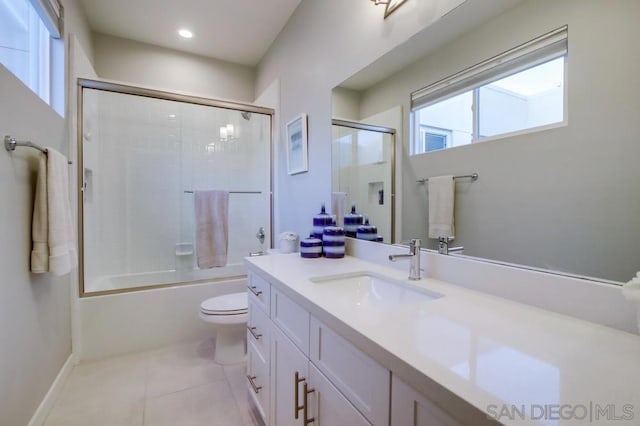 full bathroom with enclosed tub / shower combo, toilet, tile patterned floors, and vanity