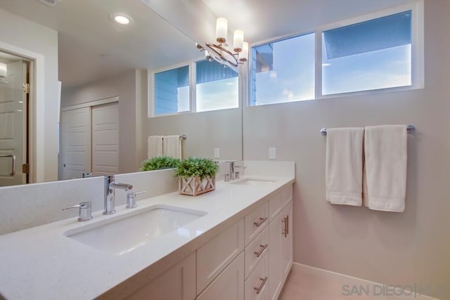 bathroom with a healthy amount of sunlight and vanity