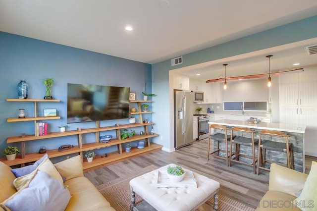 living room featuring light wood-type flooring