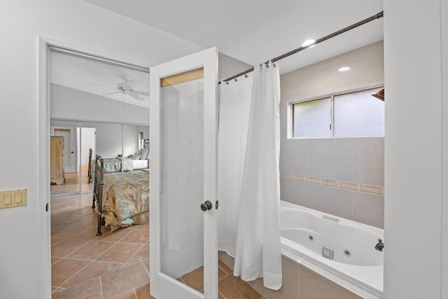 bathroom featuring ceiling fan, tile patterned floors, and shower / bathtub combination with curtain