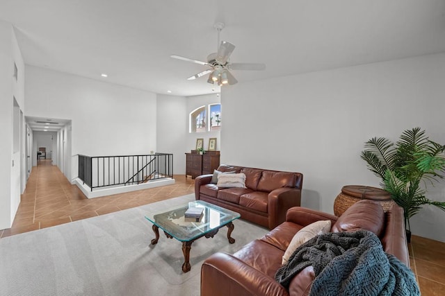 tiled living room featuring ceiling fan