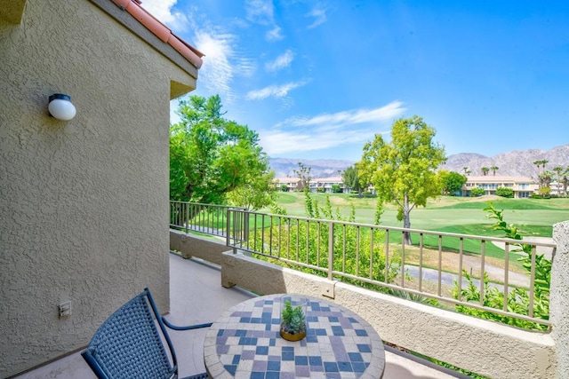 balcony featuring a mountain view