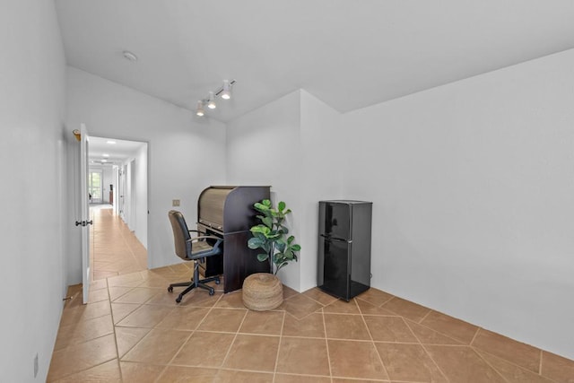 tiled home office with lofted ceiling